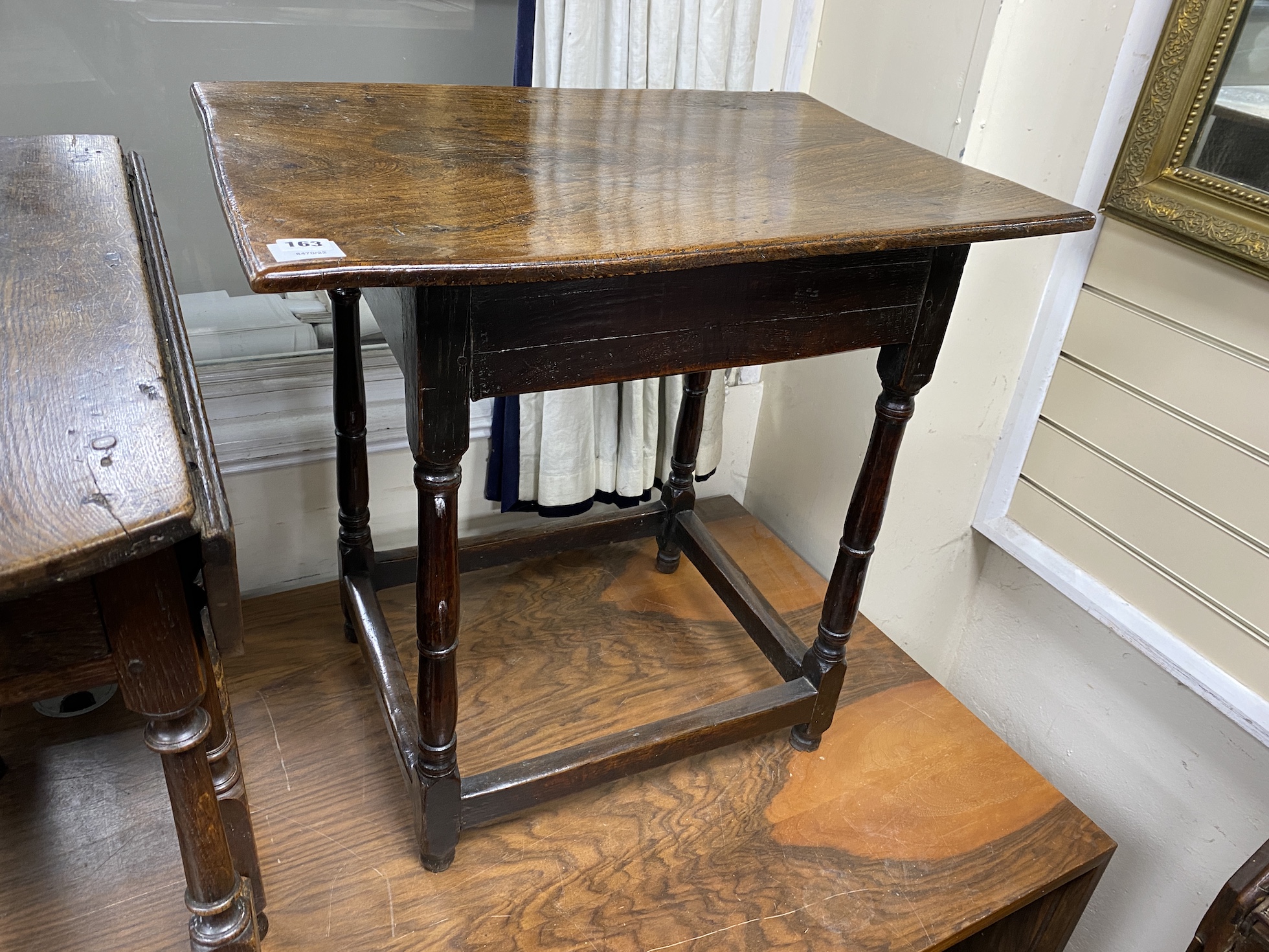 A late 17th century William and Mary oak and elm small rectangular centre table, the square and ring turned supports joined by peripheral stretchers, width 69cm, depth 48cm, height 66cm